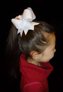 Sample photo below same size/similar style bow on 8 yr. old