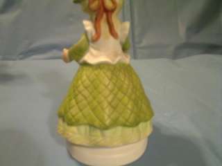 This MEGAN & FRIENDS GIRL WITH FLOWER POT FIGURINE HEARTLINE is in 