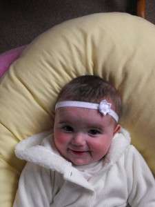 Below Baby Madison aged 5 months wearing a selection of the headbands 