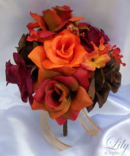 single brown rose bud decorated with gold bow and tails