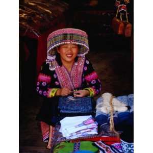  Hmong Village Woman Wearing a Tribal Hat at a Cloth Stall 