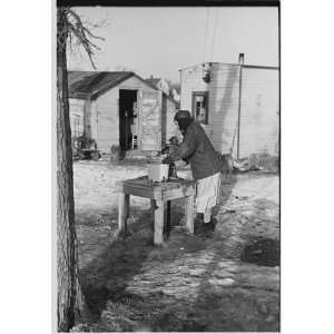   pumping water for laundry, Shantytown, Spencer, Iowa