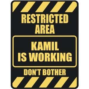   RESTRICTED AREA KAMIL IS WORKING  PARKING SIGN