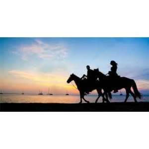  COUPLE RIDING HORSES AT SUNSET   2644