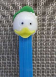 DUCK CHILD PEZ A   WHITE HEAD   GREEN HAT   PAINTED EYES *  