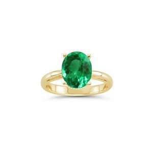  0.62 Cts of 7x5 mm AAA Oval Emerald Scroll Ring in 18K 