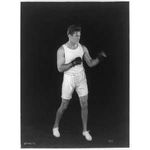  Gene Tunney,wearing shorts,boxing gloves,fists raised 