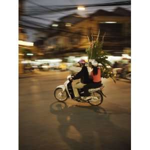  Couple on Moped Carrying Floral Display, Hanoi, Vietnam 